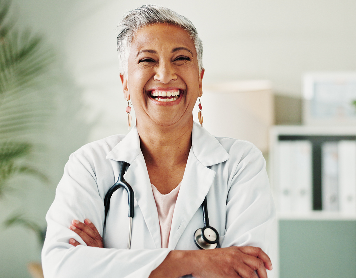 Portrait, doctor and woman with arms crossed, happy or confident for healthcare in clinic or life insurance. Hospital, medical professional and mature person with smile for career, internist or proud